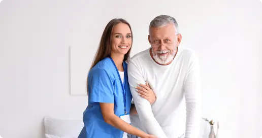 A young female nurse assists an elderly man at MusicValley Senior Advisors